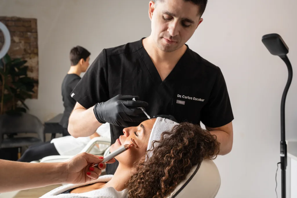Doctor Carlos Escobar performing anti-wrinkle injections treatment at The Axis Clinic.