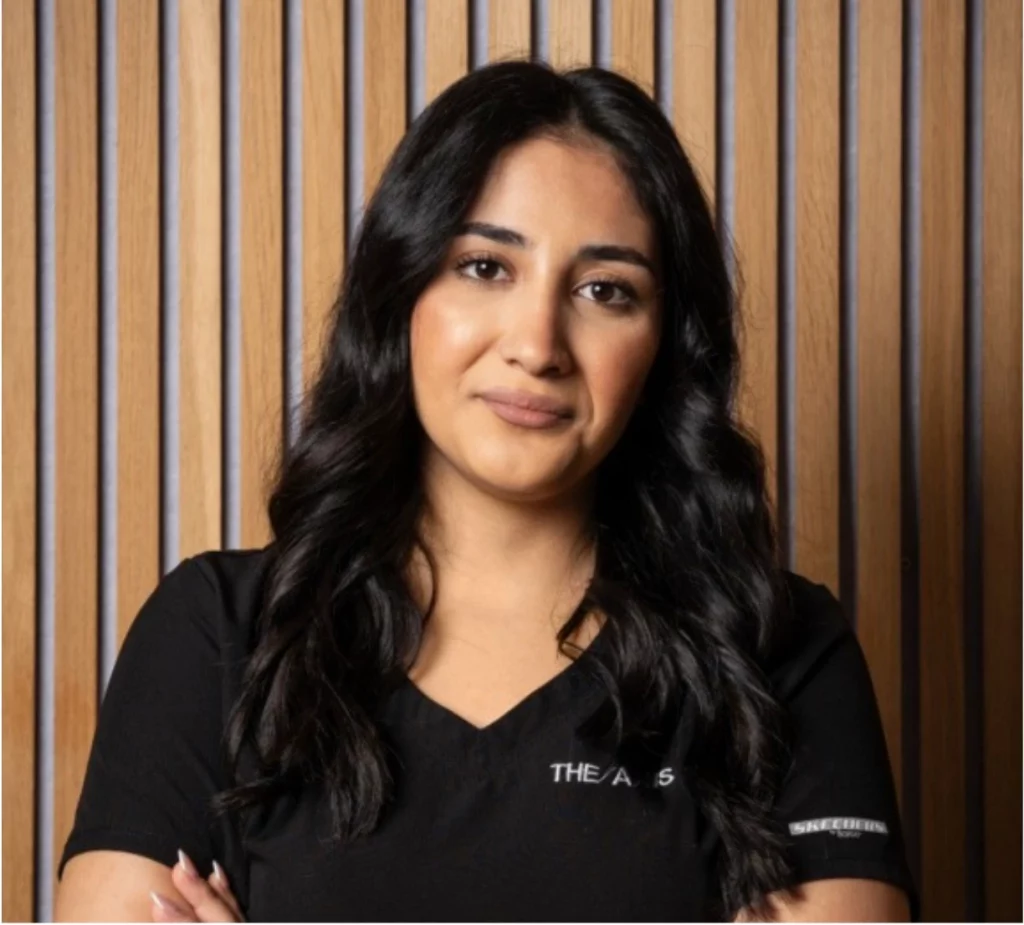 Sara, Skin & Laser Therapist, smiling confidently in professional uniform.