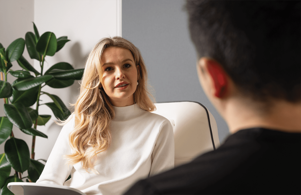 Patient consultation for Radiesse treatment with Dr. Carlos Escobar at The Axis Clinic