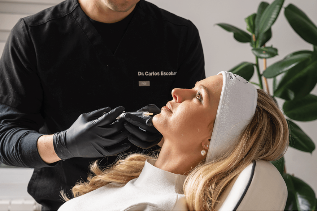 Dr Carlos Escobar performing Radiesse dermal filler treatment at The Axis Clinic London.